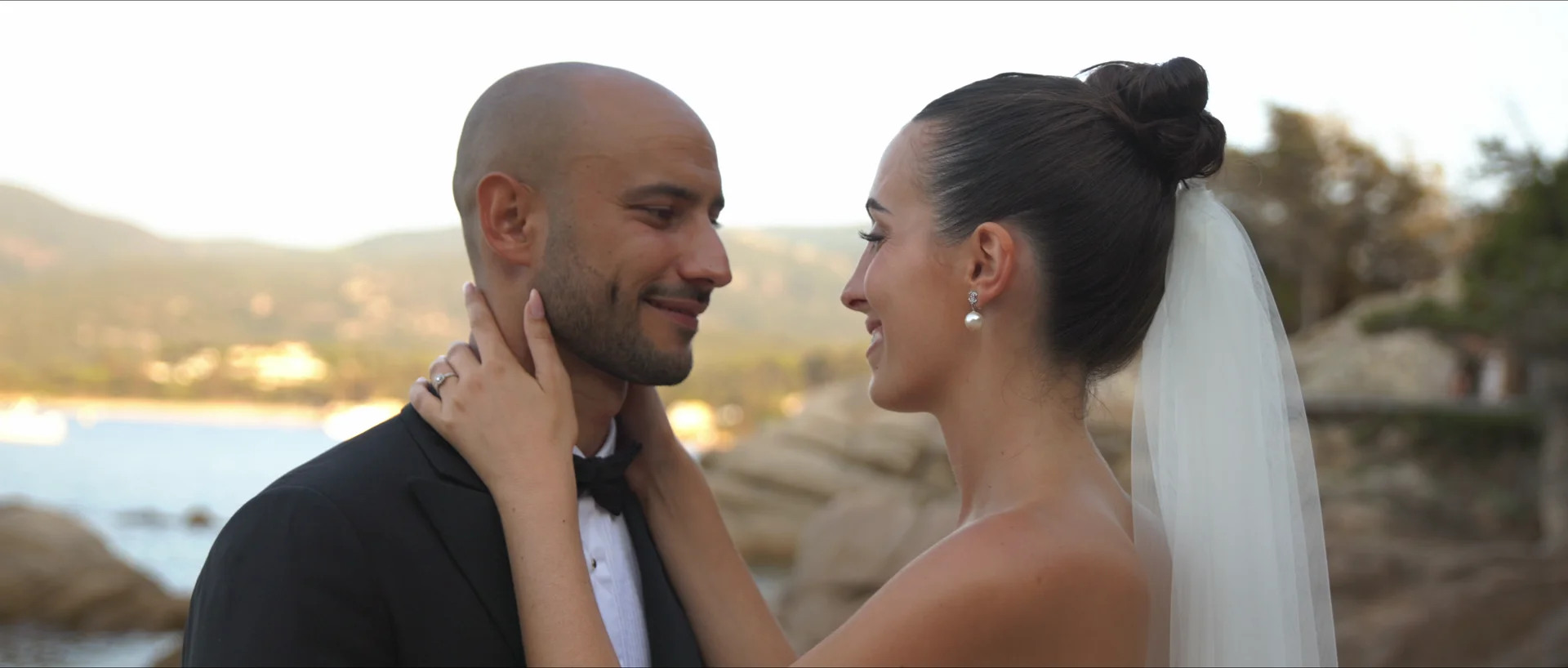 Newlyweds face to face by the sea at Domaine de Lagnonu, Corsica